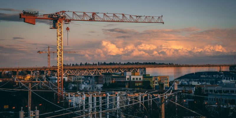 beautiful view of a construction site in a city during sunset